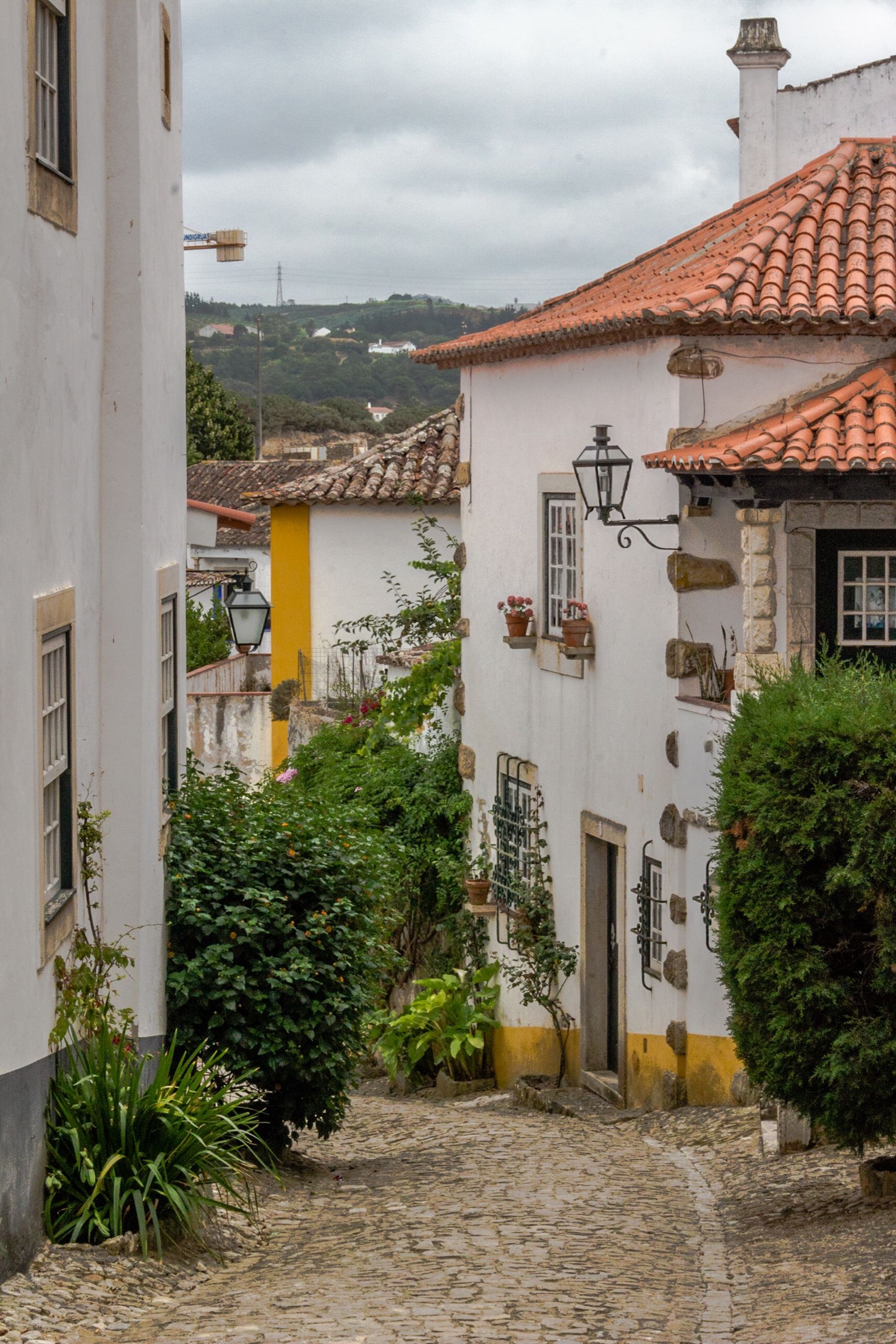 Historic whitewashed street in Óbidos, Portugal