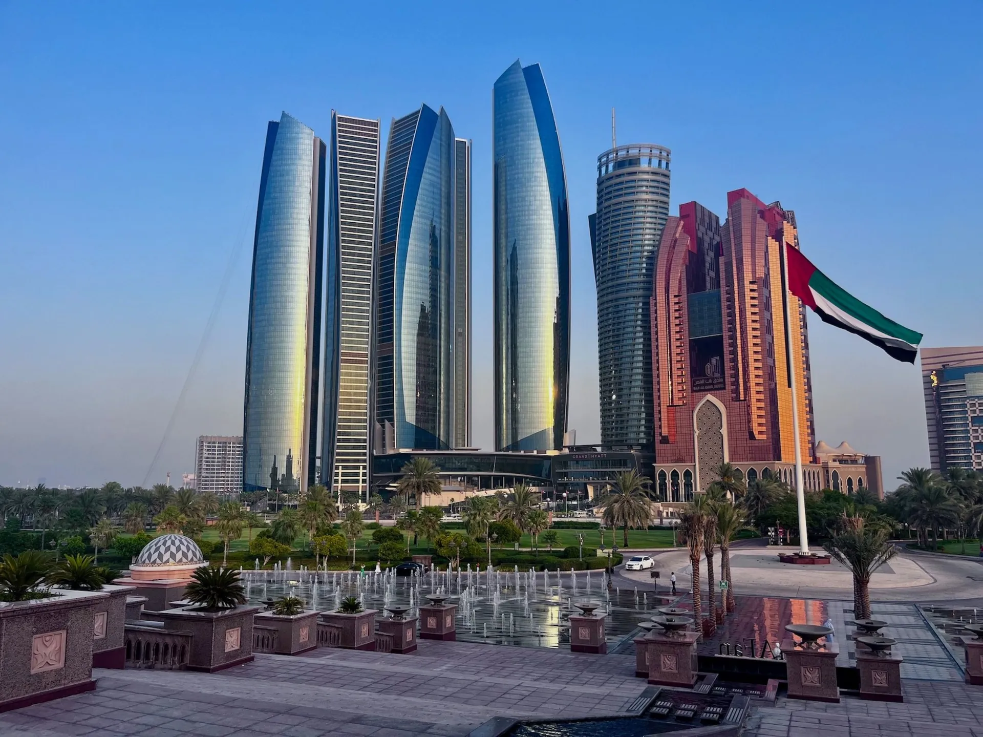 Etihad Towers and a UAE flag in Abu Dhabi