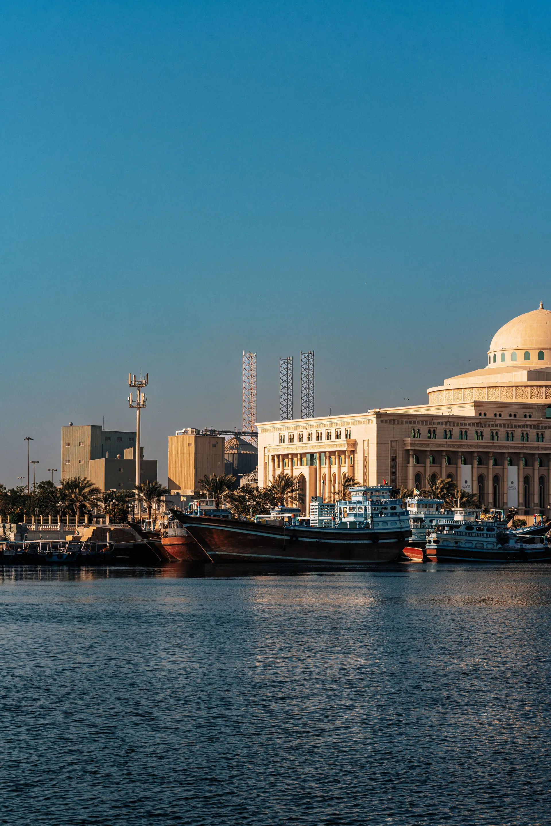 Traditional dhows beside Sharjah Museum of Islamic Civilization