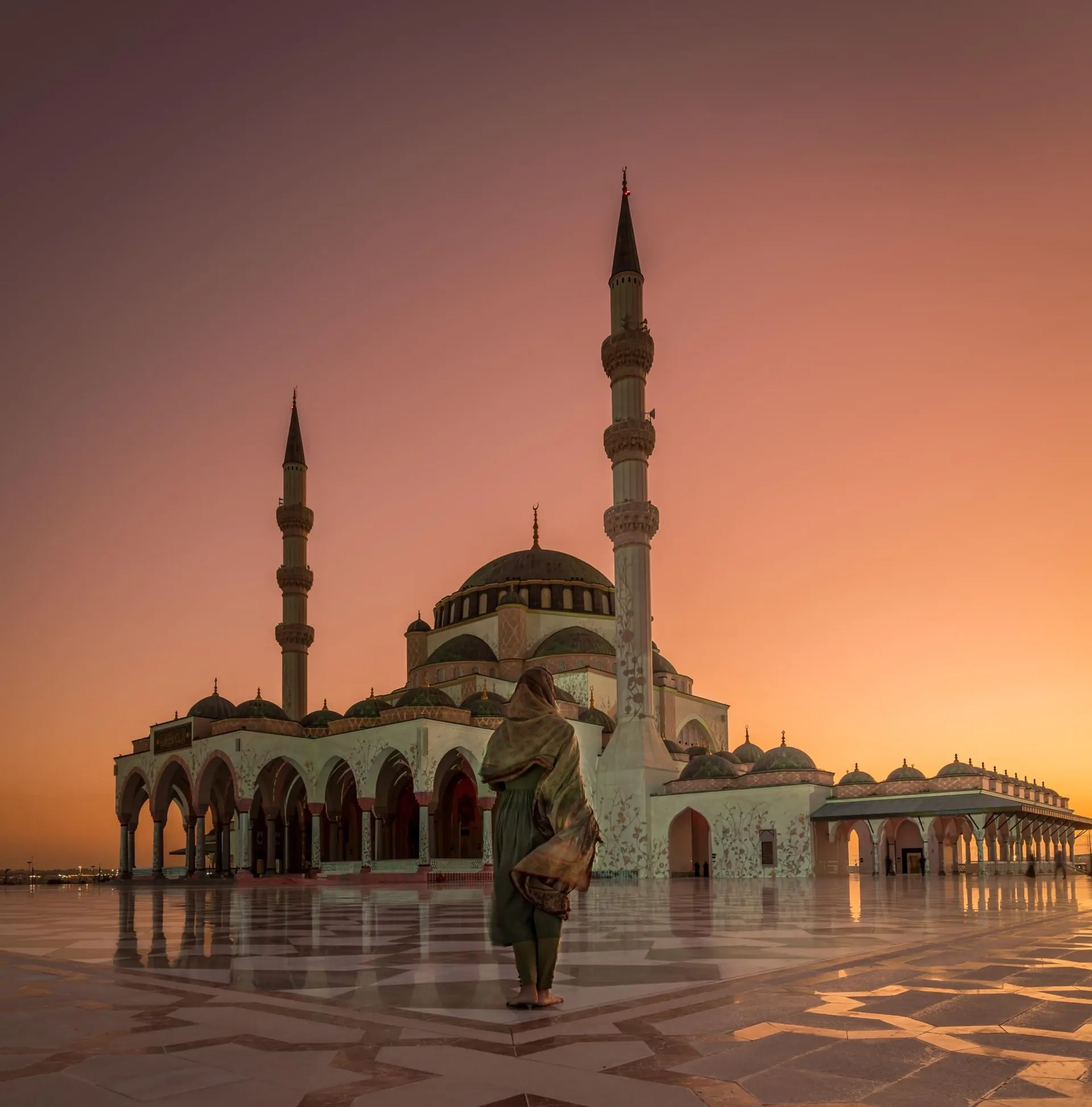 Sharjah Mosque courtyard and minarets at sunset